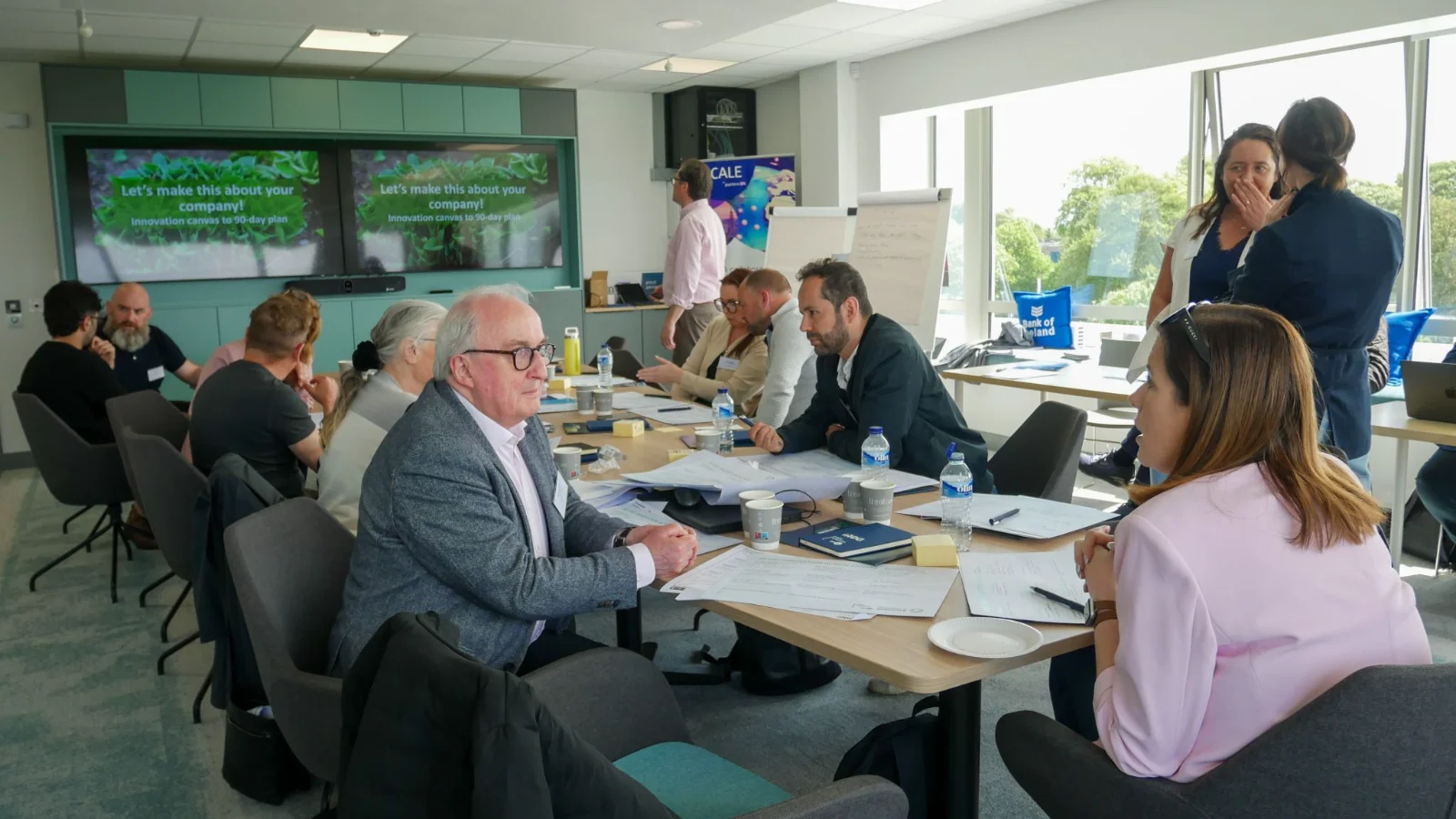 SME leaders working at tables during a Growth Workshop